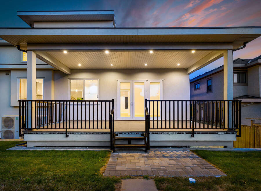 This stunning home boasts a covered deck, perfect for outdoor entertaining and relaxation.