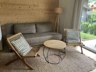 This cozy living room features a comfortable sofa, perfect for relaxing after a long day.