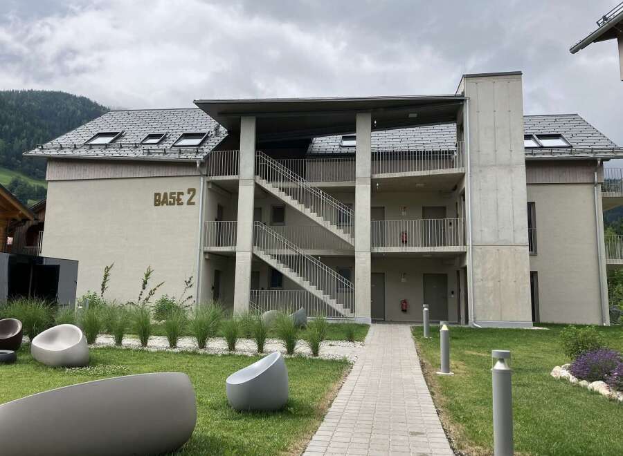 Discover modern living in this apartment complex featuring open-air staircases and balconies.