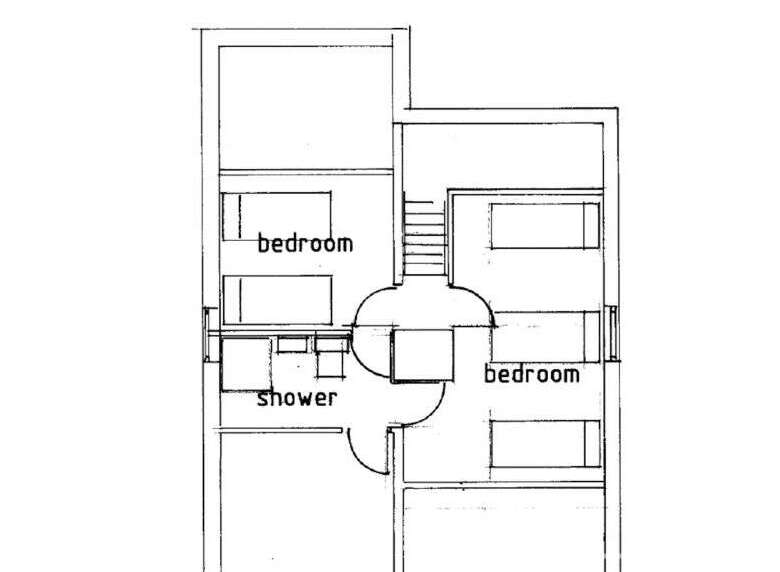 This two-story floor plan of the Rosta house features two bedrooms and a shower.