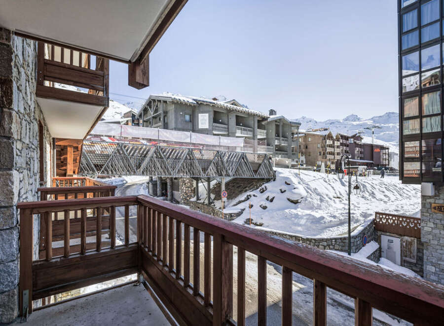 Overlooking a snowy landscape, this property boasts stunning mountain views.