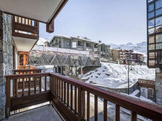Overlooking a snowy landscape, this property boasts stunning mountain views.