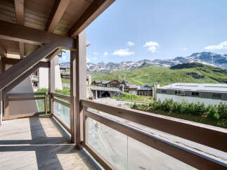 Enjoy breathtaking mountain views from this charming balcony.