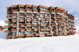 Ski-in/ski-out condo building featuring private balconies with mountain views.