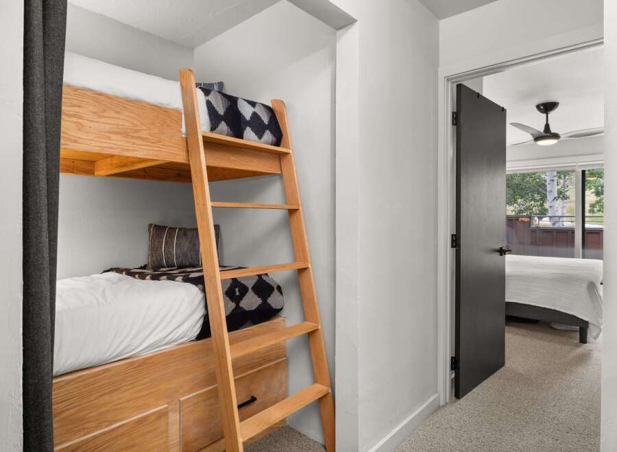 This bedroom features custom built-in bunk beds, maximizing space and functionality.