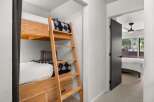 This bedroom features custom built-in bunk beds, maximizing space and functionality.