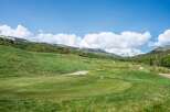 Discover luxury real estate nestled in a picturesque golf course community with stunning mountain views.