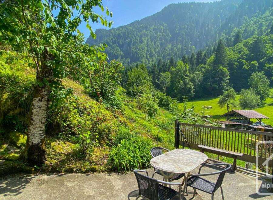 Discover this serene mountain retreat with lush greenery and stunning views.