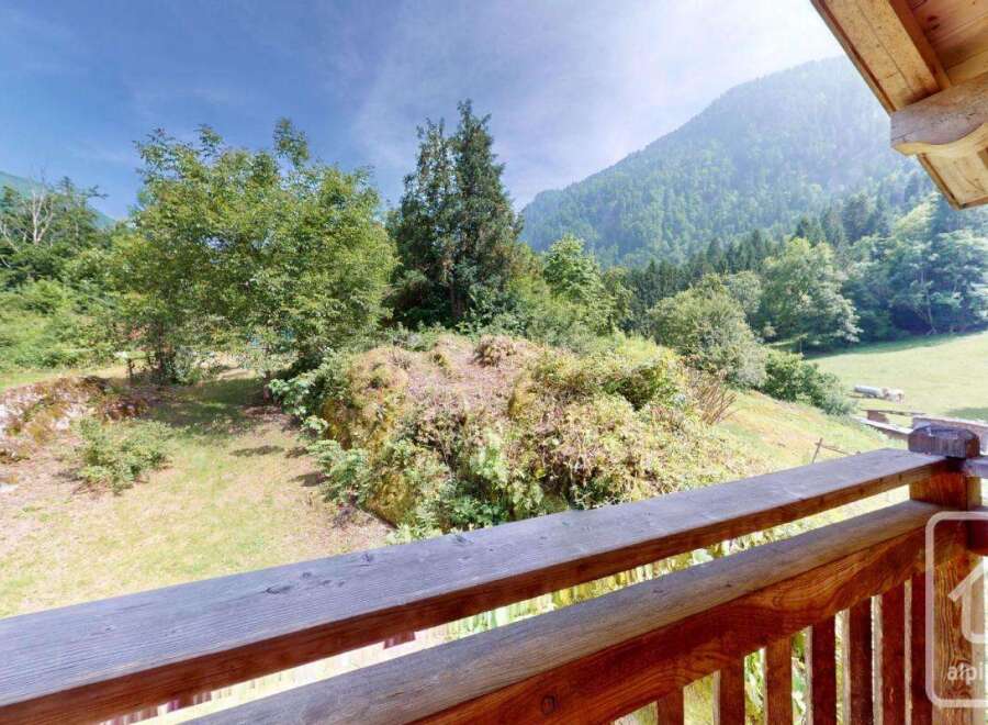 Escape to this mountain retreat and enjoy breathtaking views from the wooden balcony.