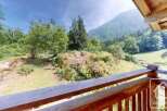 Escape to this mountain retreat and enjoy breathtaking views from the wooden balcony.