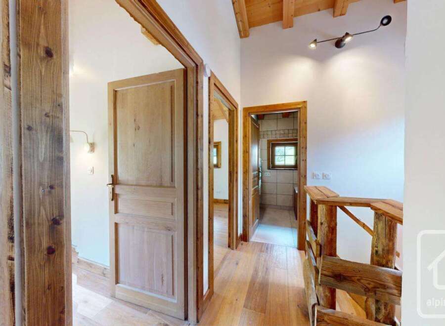 Step into this charming property featuring natural wood finishes, creating a warm and inviting atmosphere.