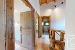 Step into this charming property featuring natural wood finishes, creating a warm and inviting atmosphere.