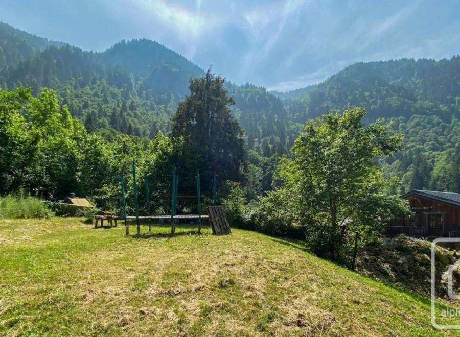 Nestled in a lush valley, this property offers a serene escape with stunning mountain views.