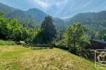 Nestled in a lush valley, this property offers a serene escape with stunning mountain views.