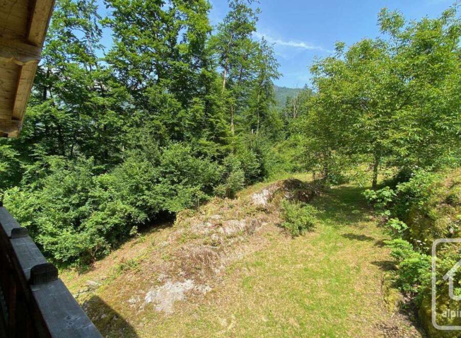 Nestled amongst lush greenery, this property offers a serene escape.