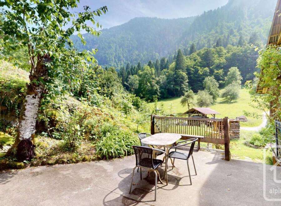 Enjoy the serene beauty of this property's outdoor space, featuring a charming patio perfect for al fresco dining.