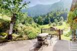 Enjoy the serene beauty of this property's outdoor space, featuring a charming patio perfect for al fresco dining.