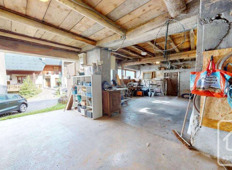 This spacious garage offers ample storage and workspace, perfect for DIY enthusiasts or car enthusiasts.