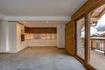 Experience luxury living in this stunning property featuring a modern kitchen with sleek cabinetry and high-end appliances.
