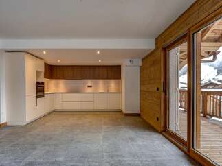Experience luxury living in this stunning property featuring a modern kitchen with sleek cabinetry and high-end appliances.