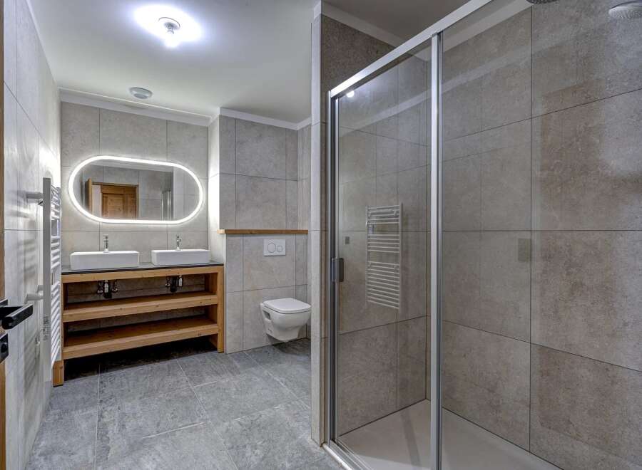Step into a modern bathroom oasis, featuring a sleek design and high-end finishes.
