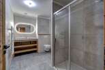 Step into a modern bathroom oasis, featuring a sleek design and high-end finishes.