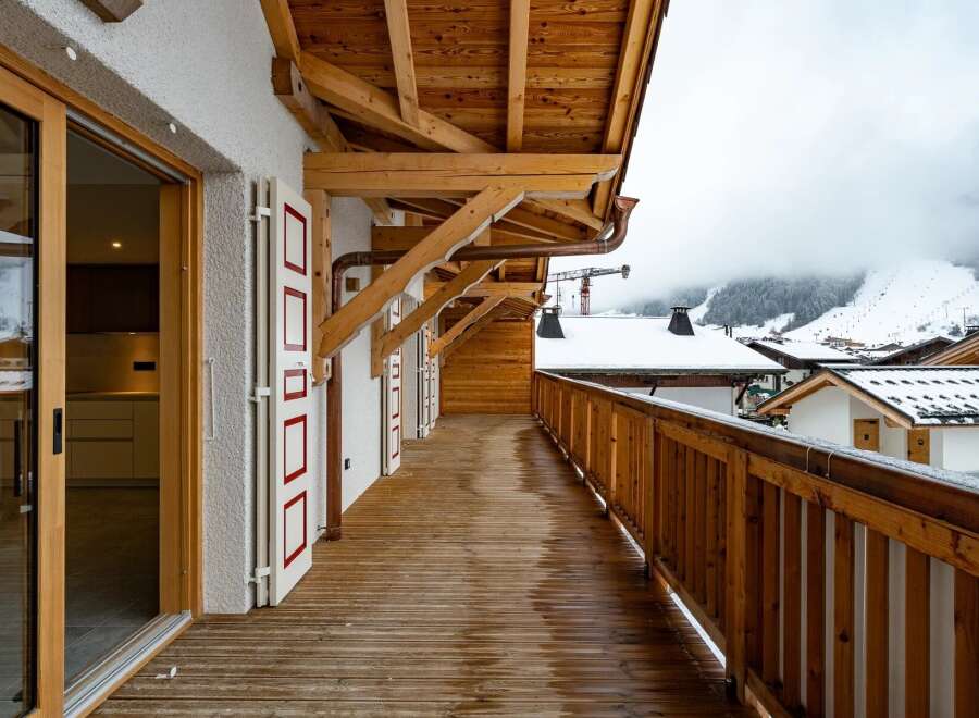 Experience the charm of this stunning property featuring a spacious balcony with breathtaking mountain views.