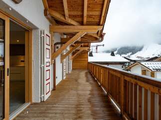Experience the charm of this stunning property featuring a spacious balcony with breathtaking mountain views.