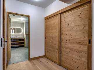 Step into luxury with this stunning property featuring exquisite wooden sliding doors and a beautifully designed bathroom.