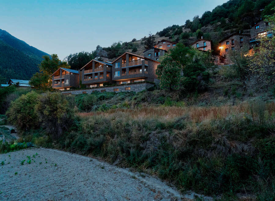 Nestled in the mountains, these stone-clad properties offer a serene escape with stunning natural surroundings.