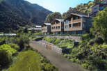 Discover luxury living in these stunning stone-clad villas nestled in a serene mountain setting.
