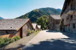 Discover charming stone houses nestled in a serene mountain village.
