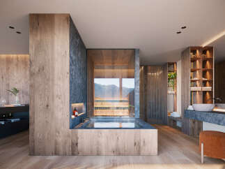 This modern bathroom features a luxurious soaking tub with mountain views, complemented by natural wood finishes and stone accents.