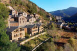 Discover hillside homes in a serene mountain village, offering a tranquil escape.