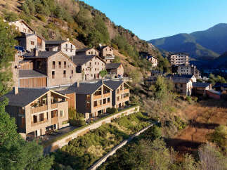 Discover hillside homes in a serene mountain village, offering a tranquil escape.