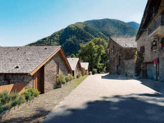 Discover charming stone houses nestled in a serene mountain village.