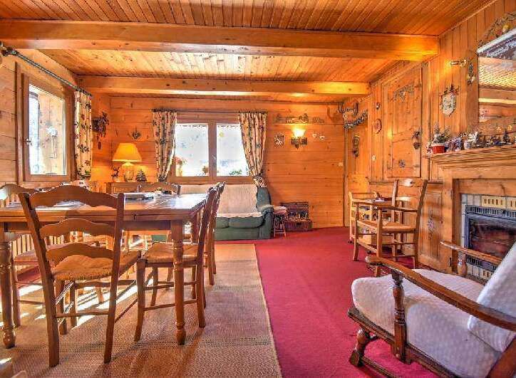 Step into this charming cabin featuring rich wood paneling and flooring, creating a warm and inviting ambiance.