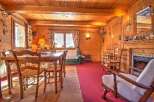 Step into this charming cabin featuring rich wood paneling and flooring, creating a warm and inviting ambiance.