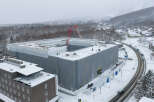 Midtown Niseko, a premier real estate development, is captured in this aerial view amidst a snowy landscape.
