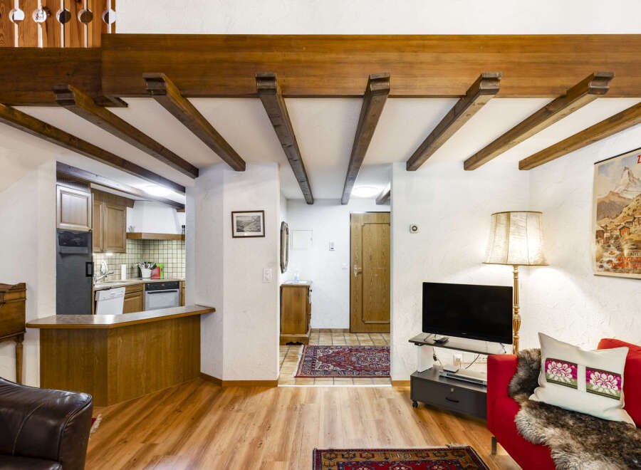 Step into this charming property featuring exposed wooden beams that add rustic elegance.