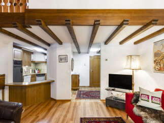 Step into this charming property featuring exposed wooden beams that add rustic elegance.