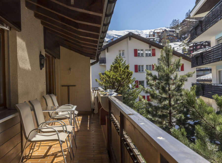 Enjoy breathtaking mountain views from this charming apartment's balcony.
