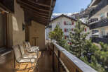 Enjoy breathtaking mountain views from this charming apartment's balcony.