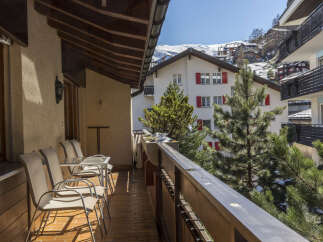 Enjoy breathtaking mountain views from this charming apartment's balcony.