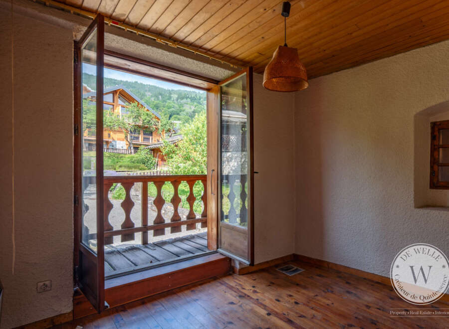 This room boasts beautiful wooden floors and ceiling, creating a warm and inviting ambiance.