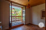 This room boasts beautiful wooden floors and ceiling, creating a warm and inviting ambiance.