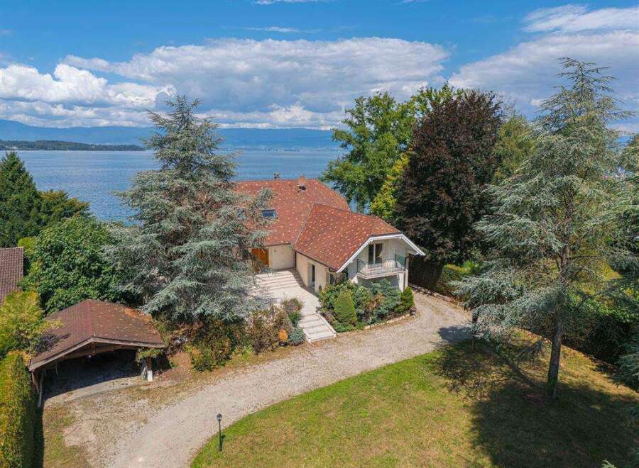Discover this stunning lakeside property with breathtaking views and a private driveway.