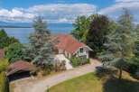 Discover this stunning lakeside property with breathtaking views and a private driveway.