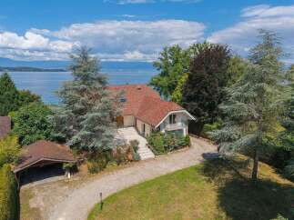 Discover this stunning lakeside property with breathtaking views and a private driveway.