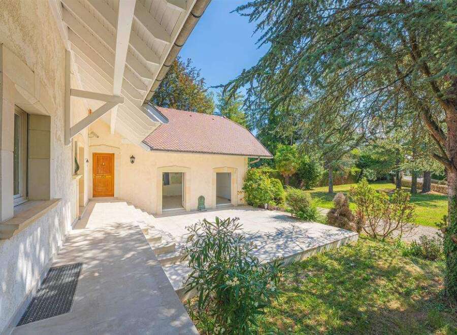 Discover this charming property featuring a welcoming front entrance and an expansive outdoor patio, perfect for entertaining.